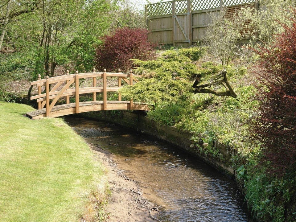 Attractive stream runs through the bottom of the garden | Greenlands Farmhouse, Barmby Moor, York