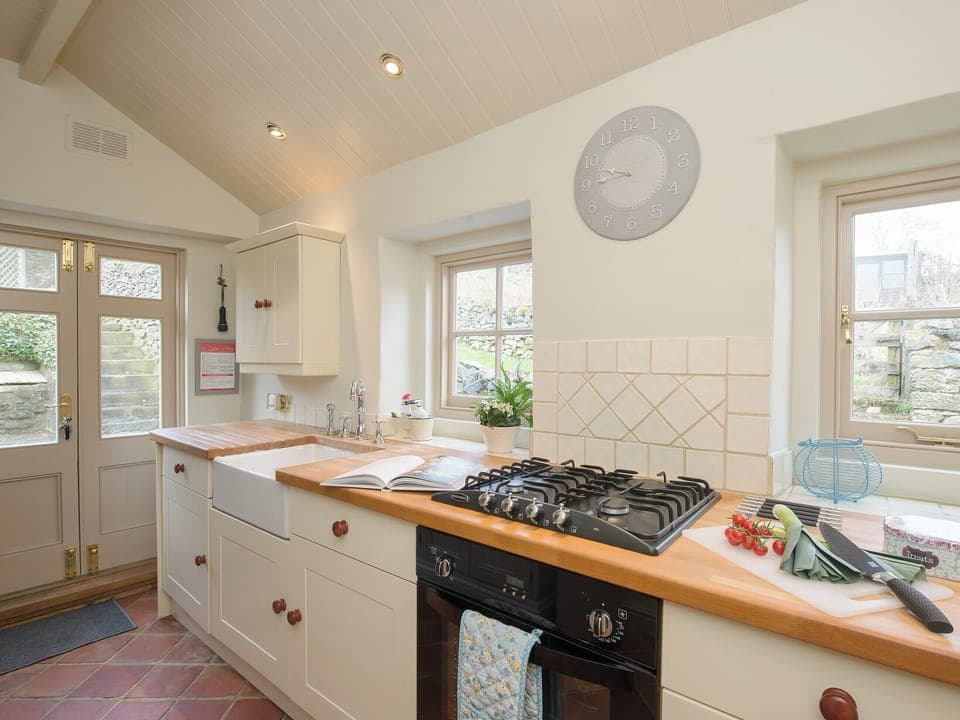 Kitchen doors lead onto the garden | Penny Cottage, Bonsall, near Matlock