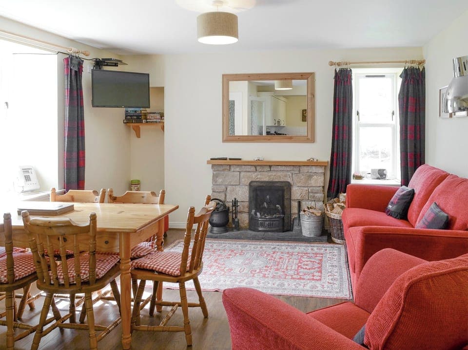 Spacious living room with convenient dining table | Rowan Cottage - Glenrossal Cottages, Rosehall, near Lairg
