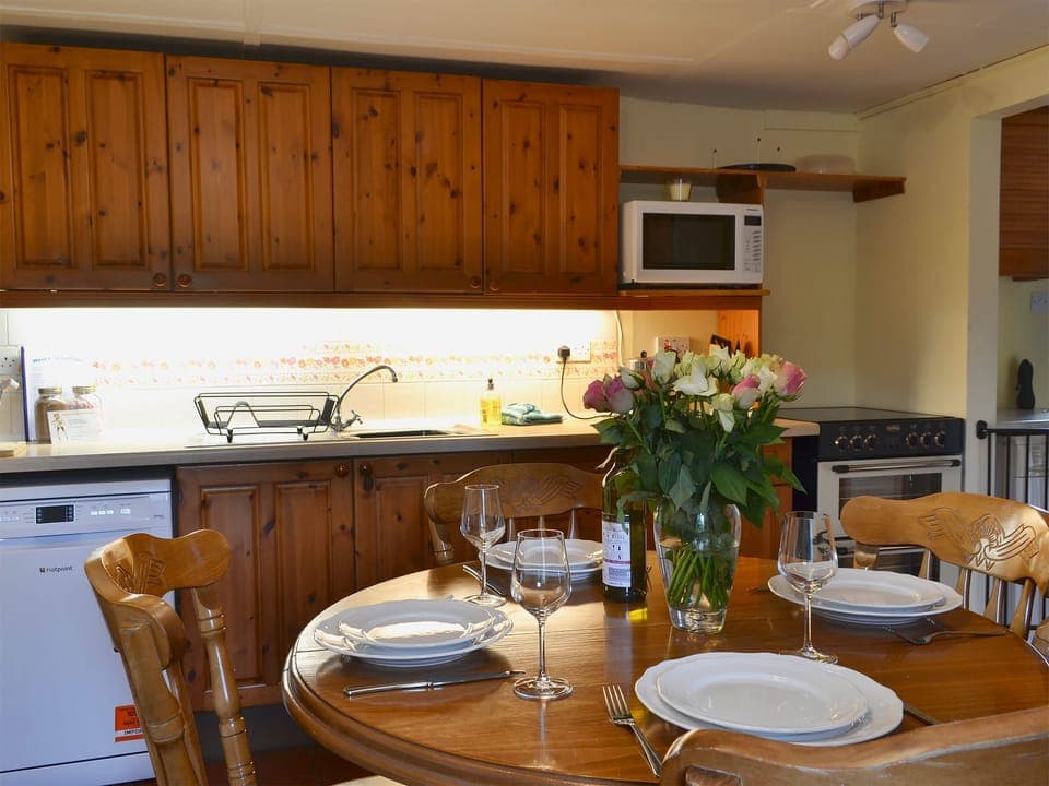 Well-equipped kitchen and dining area | West End Cottage, Carrbridge, near Aviemore