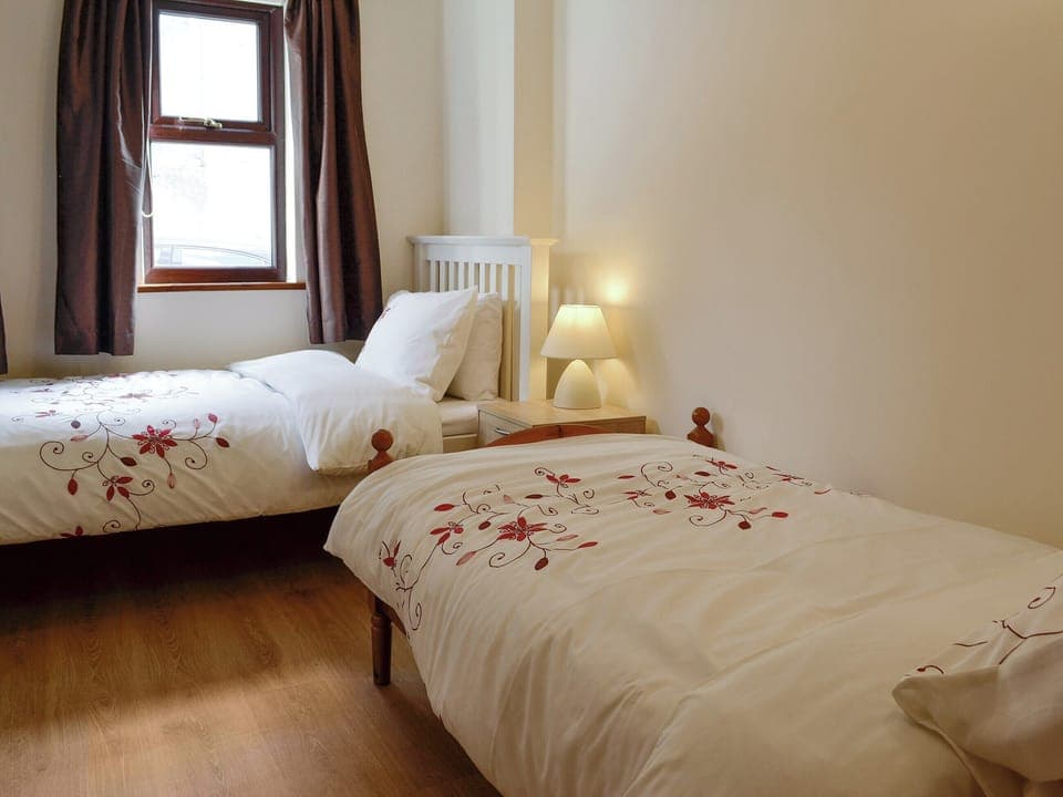 Good-sized twin bedroom | Three Views Bungalow, Talgarth, near Hay-on-Wye