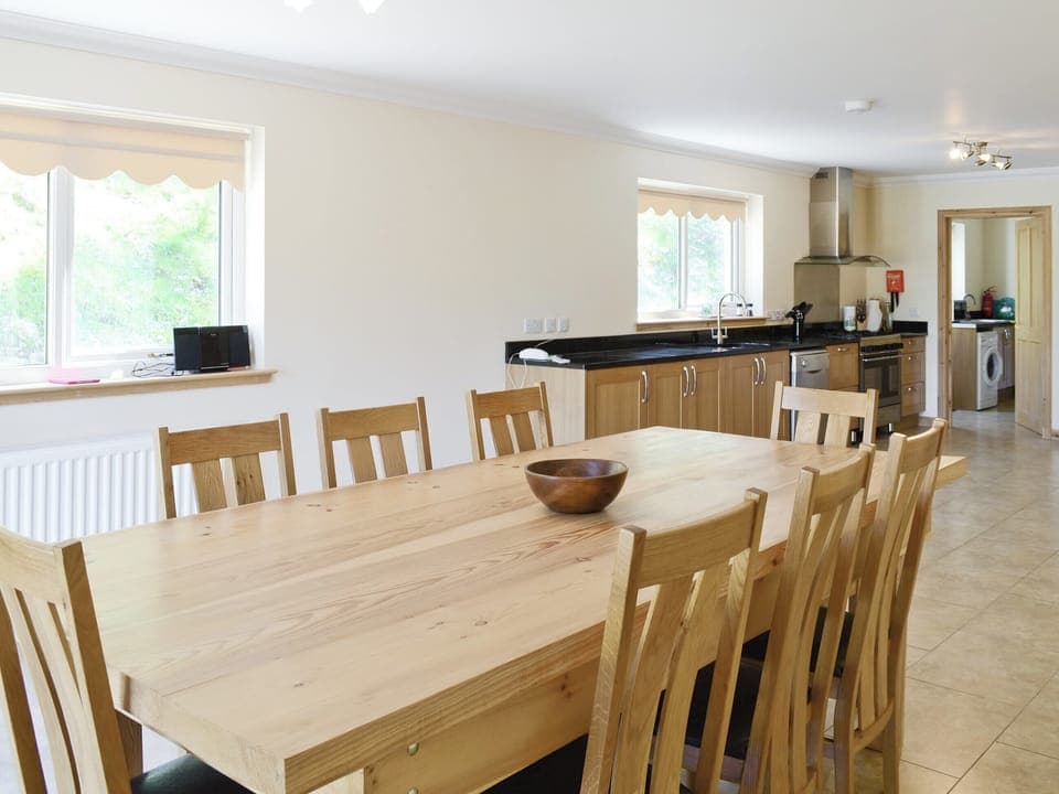 Large open plan kitchen and dining room has French windows that open out to the grounds | March Cottage, Glen Cassley, near Lairg