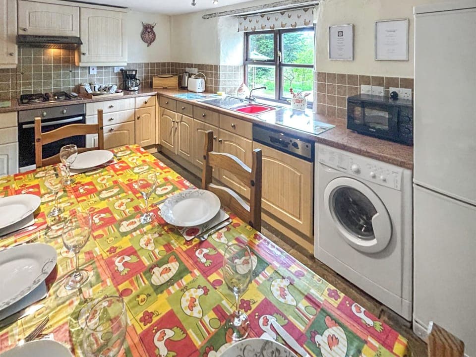 Wonderfully fitted out kitchen and dining room adjacent to the living room | Cider Cottage - Higher Checkridge Farm, Hawkchurch, near Lyme Regis