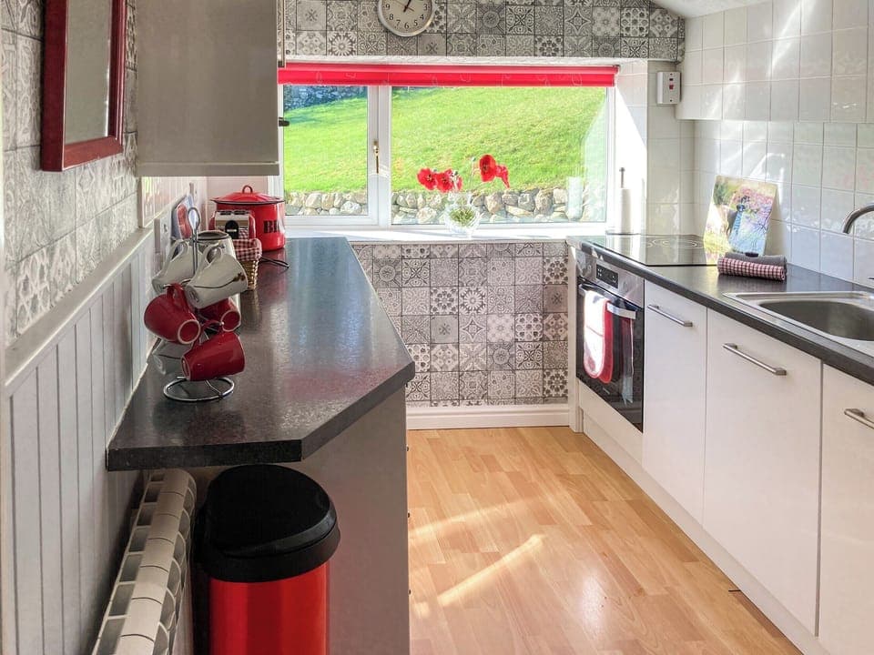 Charming kitchen overlooking the garden | Balnowlart Lodge, Ballantrae, near Girvan