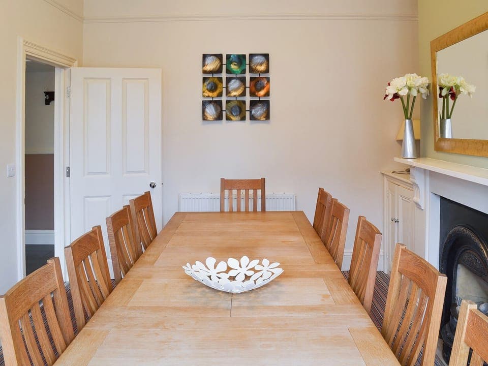 Dining room with large table seating up to 10 people | Bay House, Filey