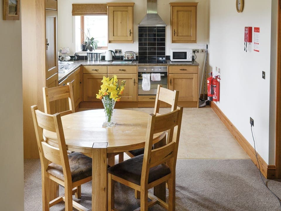 Well-equipped kitchen and convenient dining area | Hutter Hill Barn East - Hutter farm, Silsden near Skipton