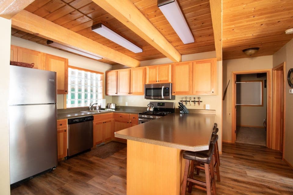 Kitchen with all the supplies you need: Gas Stove, Coffee Maker, Crockpot etc.