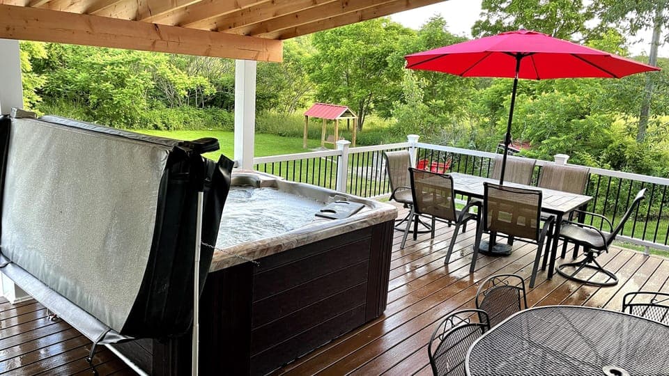 Covered Deck with Hot tub and plenty of seating