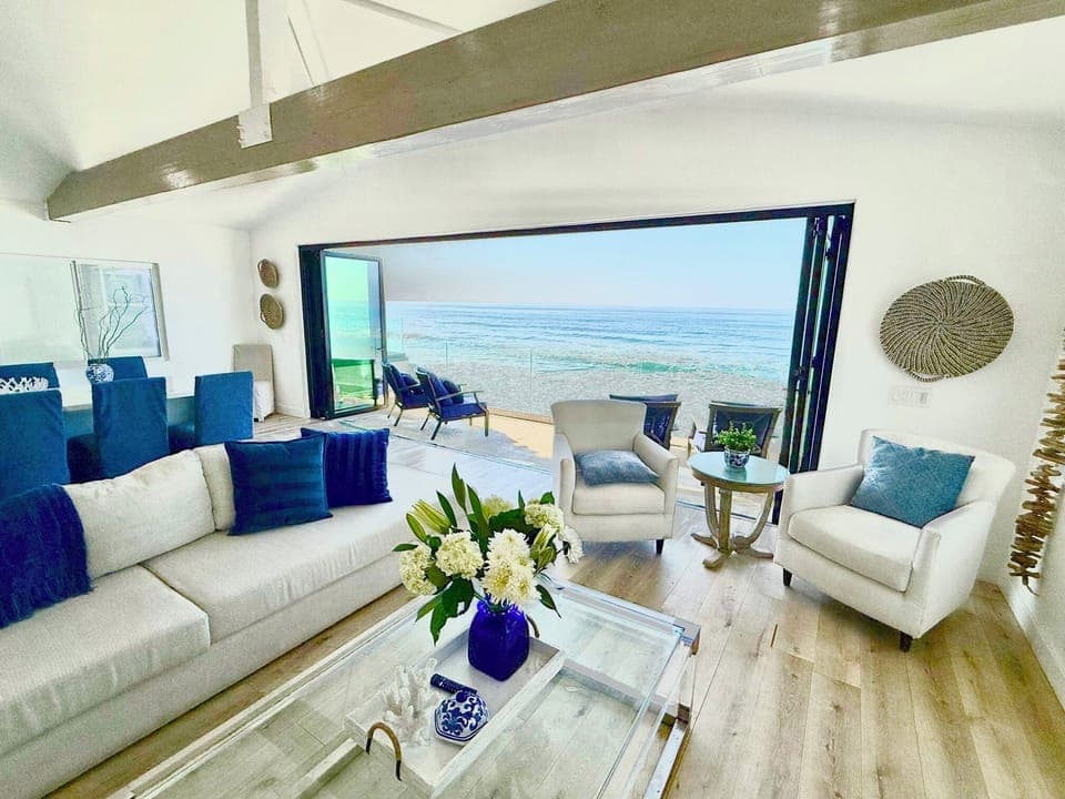 Panoramic doors make the ocean part of the living room