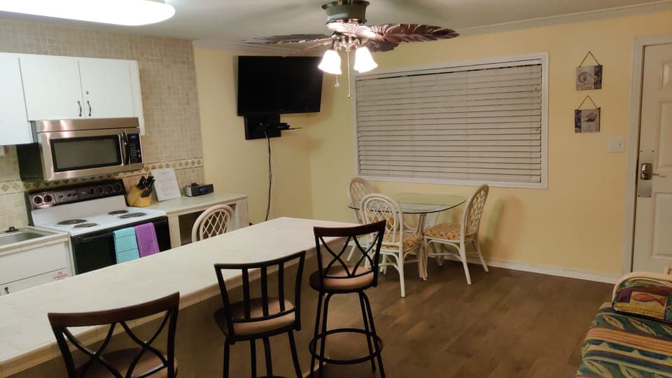 Global view, living room.  Sleeper sofa and breakfast bar.