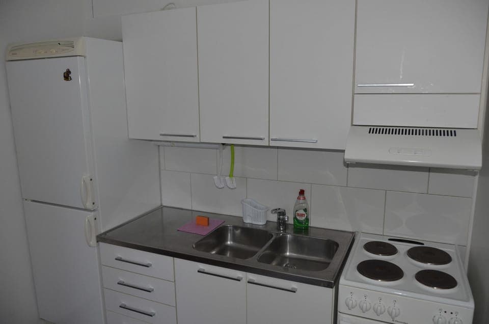 Family Apartment, 1 Bedroom, Private Bathroom | Private kitchen | Full-size fridge, microwave, electric kettle