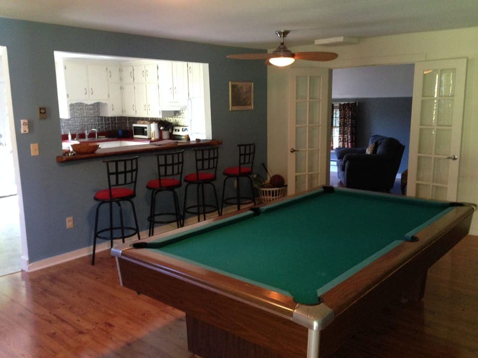 Game Room, bar opens to kitchen (seating for 6 at bar)