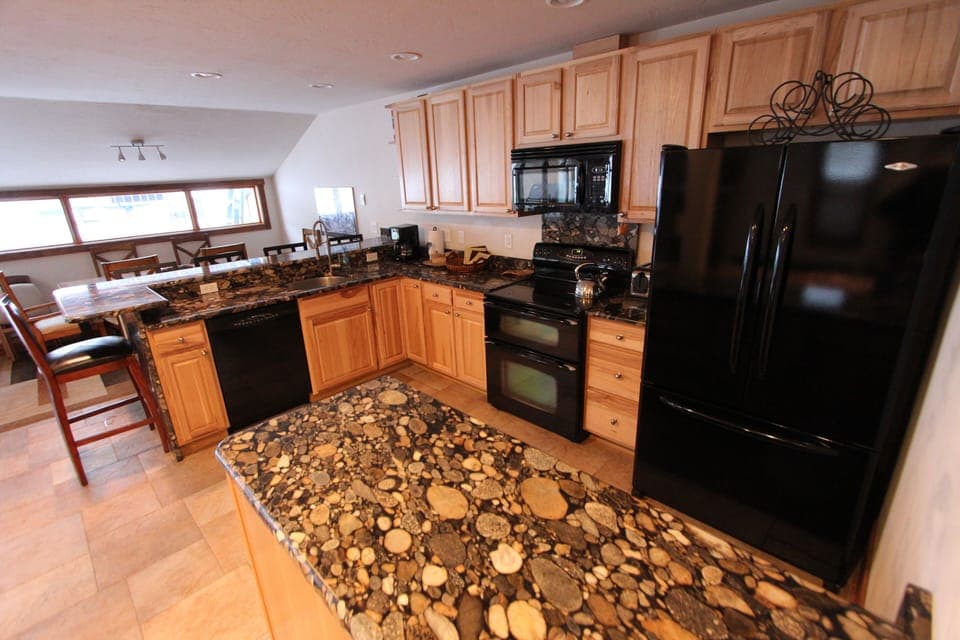 River Stone 3cm Granite countertops, double oven, Hickory cabinets. 