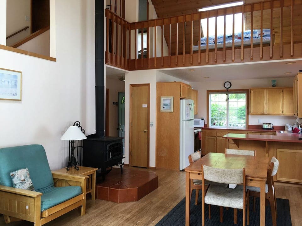 The upstairs loft area has a queen size futon.  Wood stove below.