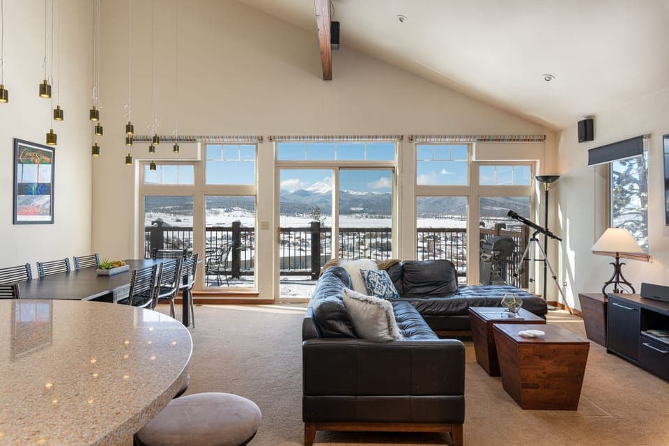 Main floor with large open plan living/dining and kitchen area and porch.