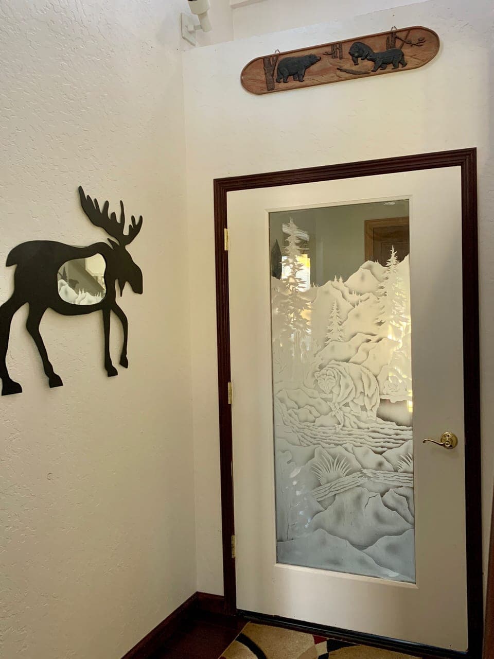 Foyer with etched glass door with Tahoe forest scene 
