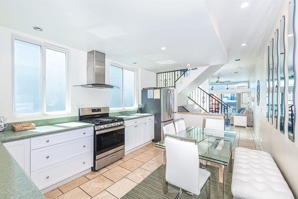 The cook's view toward the dining, living and ocean view balcony areas. Main middle level.
                