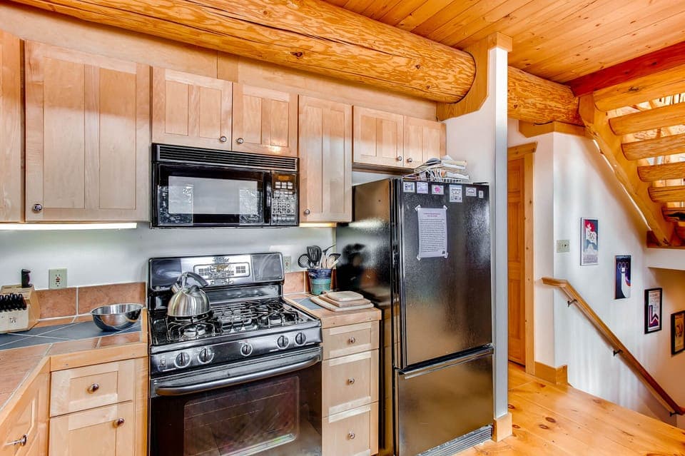 The large spacious kitchen has everything you will need to cook your meals for your stay.