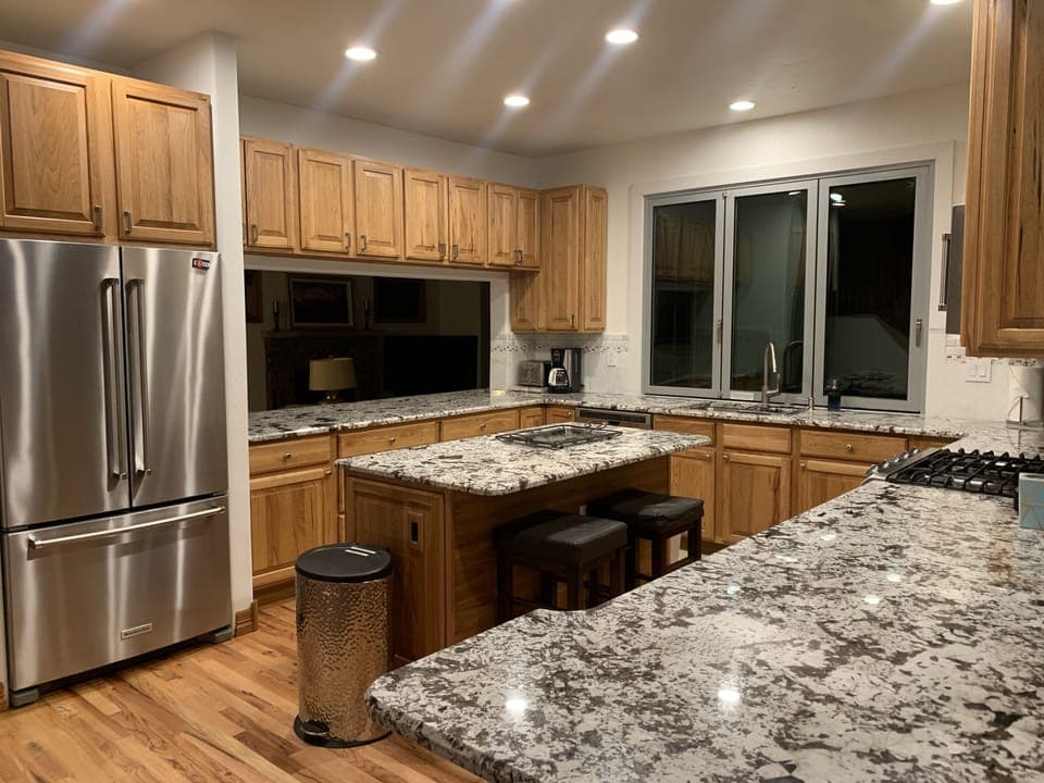 Granite countertops and KitchenAid Stainless appliances.
