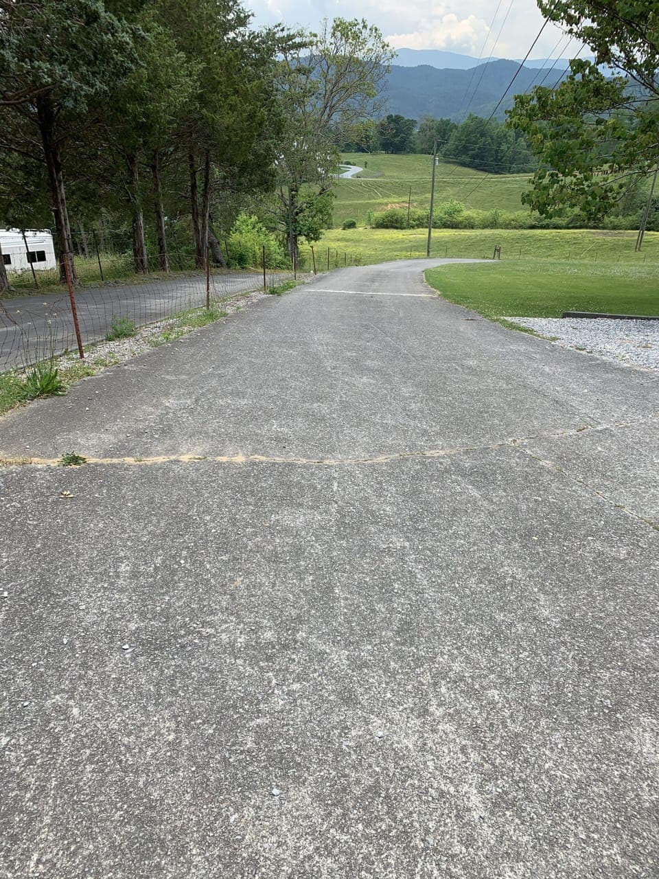 Driveway with ample parking. Additional gravel parking on side of driveway.
