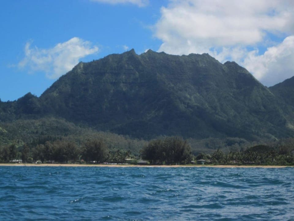 Hanalei mountain - What you would see from a paddle board or boat. The Okolehao trail starts on the left of this mountain. Caution the upper half of this trail is serious and should be done in the dry season.