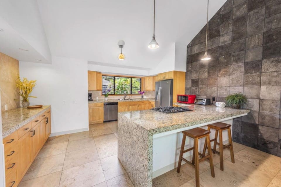 WAI kitchen - The large kitchen has what you need to make some meals and great views of the Hanalei mountain range.