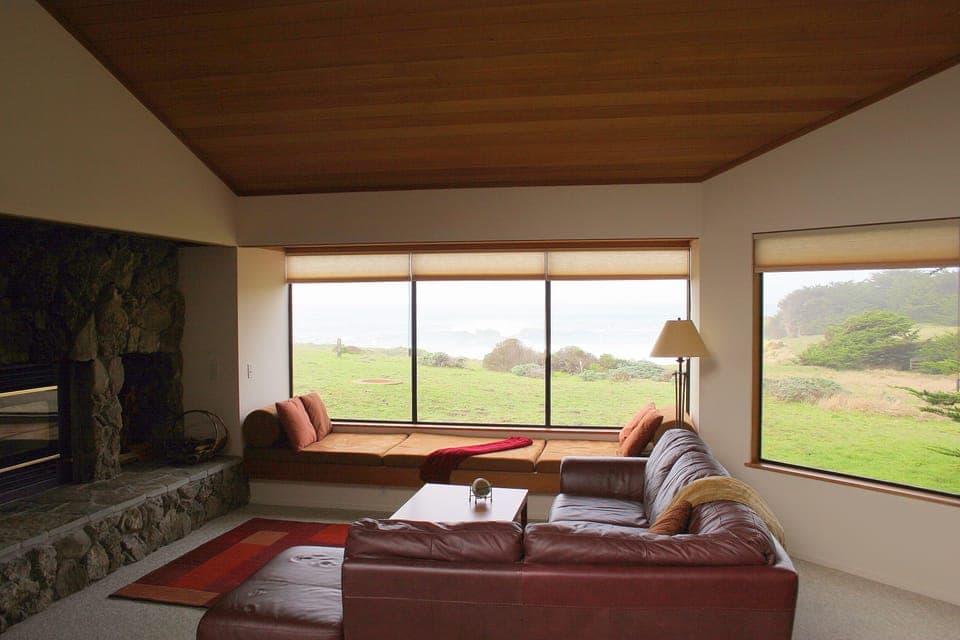 Family Room with view to bluff and ocean.  We supply the wood for the fireplace