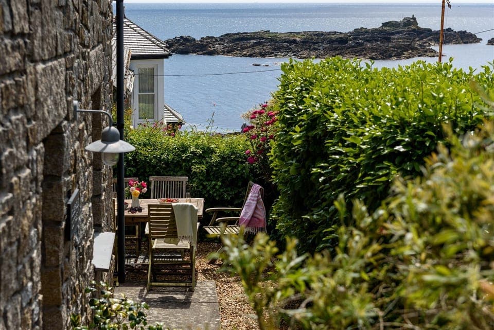 Mousehole Cottage, with private garden and sea views.