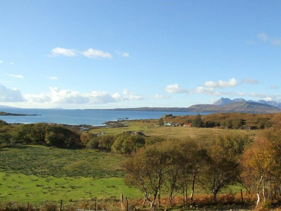 View from the sitting room to Dun Scaith Castle, the loch and the Cuillins.