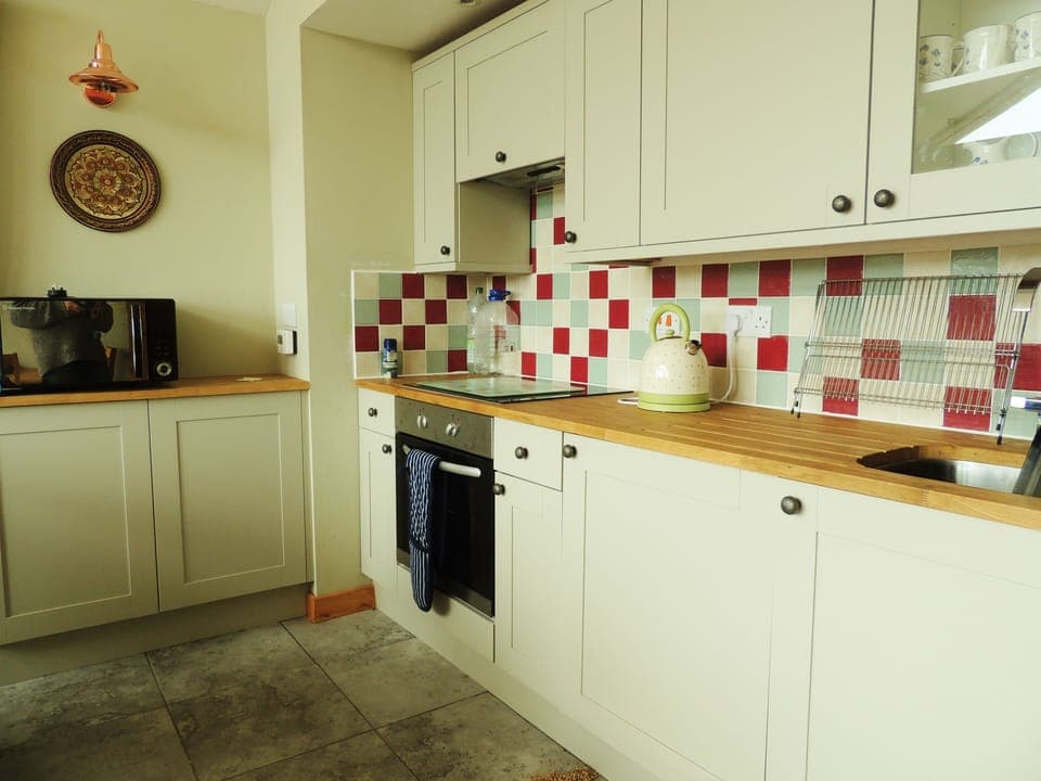 A kitchen that is clean simple and attractive and easy to work at