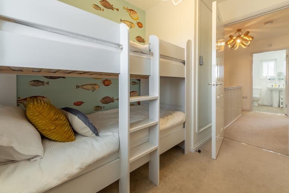 First floor: Bedroom three with full-size bunk beds