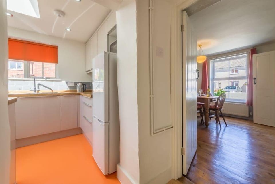 Ground floor: Kitchen leading to dining room