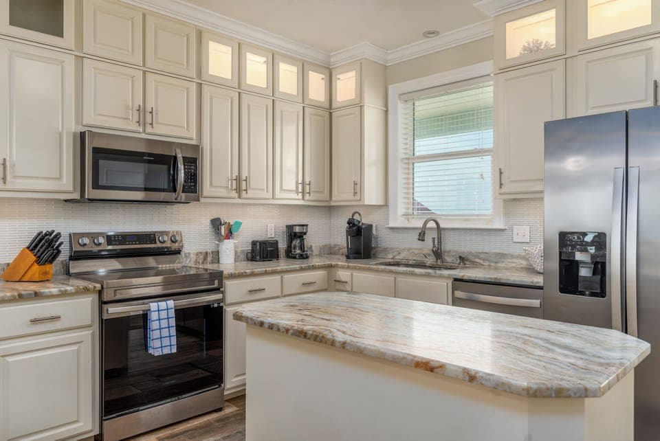 You'll love cooking in this beautifully appointed kitchen with granite countertops, stainless steel appliances, and ample storage space.