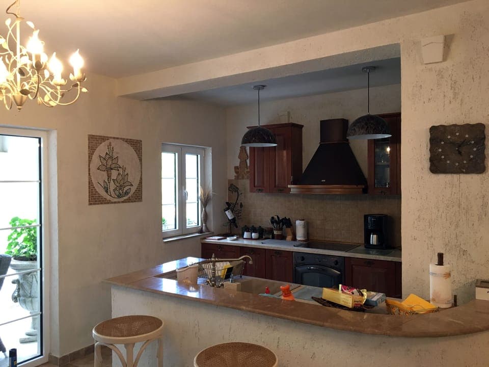 Fully equipped kitchen with utensils 