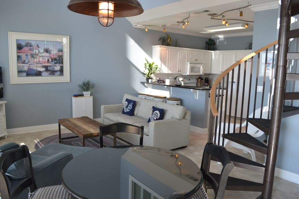 LIVING AREA WITH SPIRAL STAIRS TO MASTER SUITE