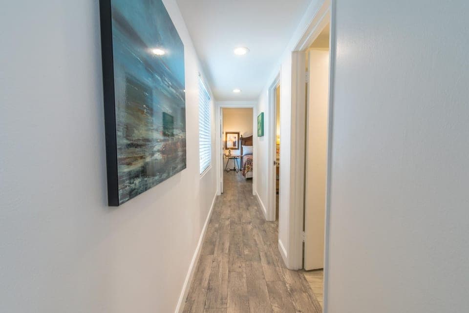 Central hallway leads from the living and kitchen areas to both bedrooms and single bathroom.
                