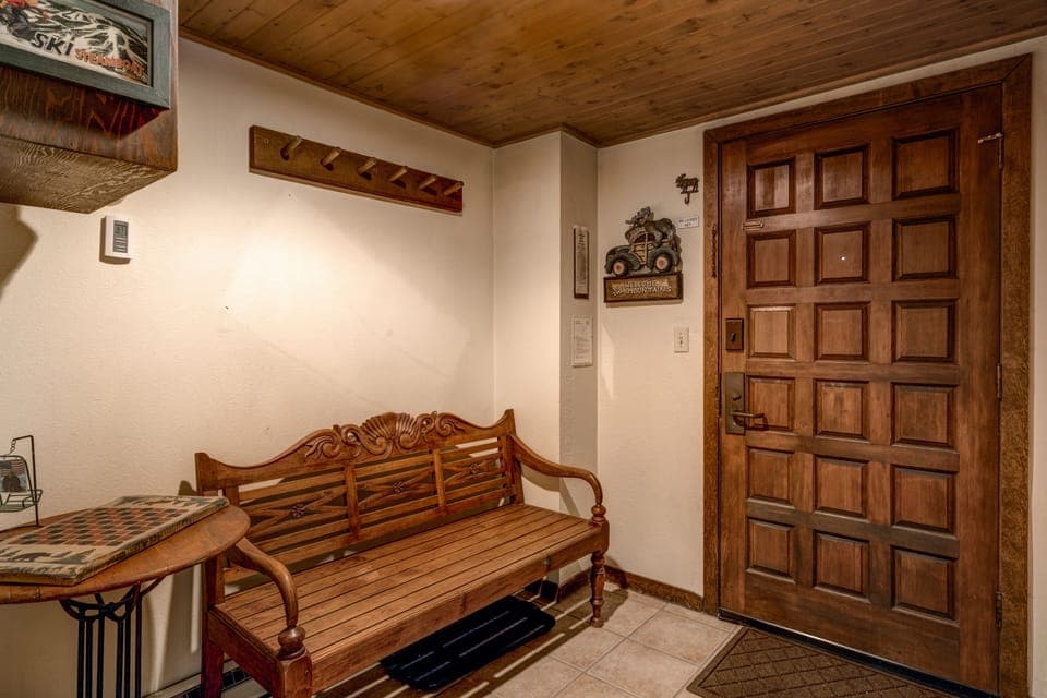 Entry area with Bench, Coat Closet, Coat Racks, and Cubbies for your mittens and such