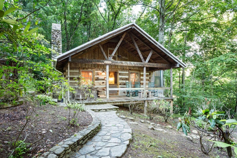 The Graves Cabin front view with rocking chair porch.