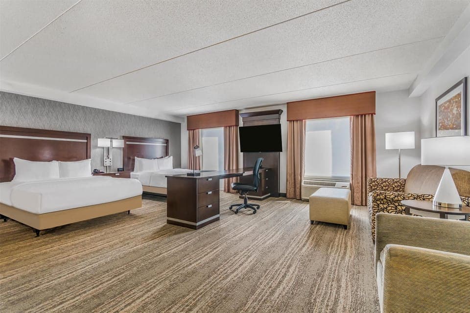 Two Queens Studio Suite with Sofabed | Desk, laptop workspace, blackout drapes, iron/ironing board
