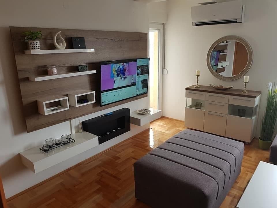 Comfort Apartment, Terrace, Beach View | Living room | 50-inch Smart TV with cable channels, TV