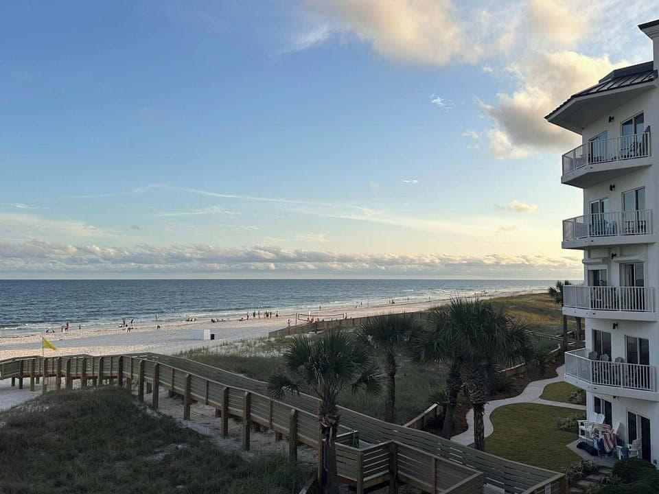 Looking over the new boardwalk to the beach from the balcony of the unit.
