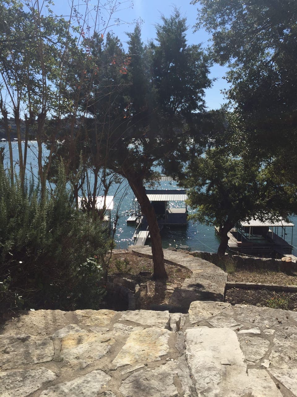 Backyard showing stone steps leading down to the boat dock.