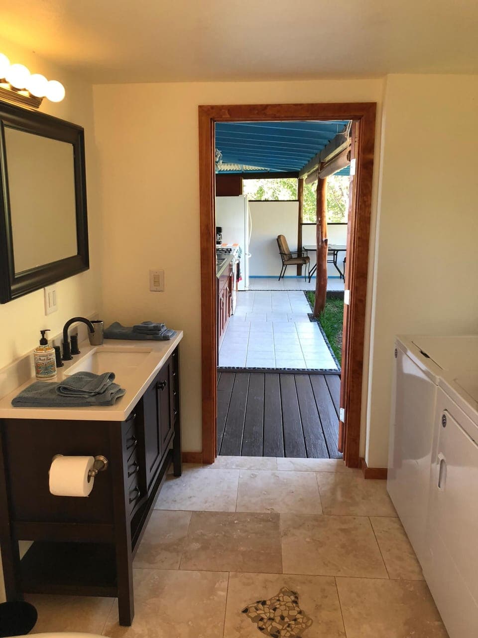 Washer and Dryer unit in bathroom.