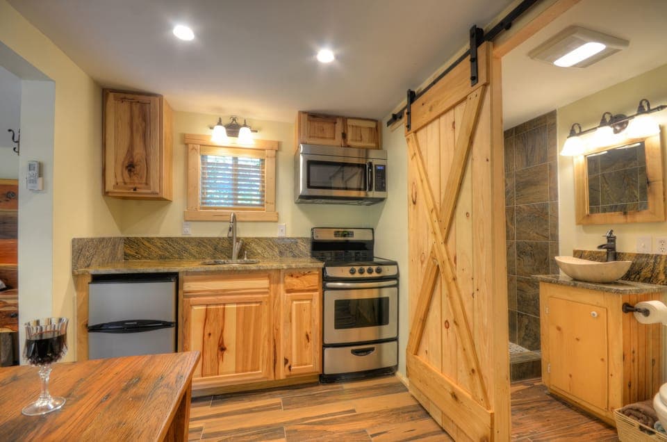 Fully equipped kitchen with stove, microwave, refrigerator, everything you need.