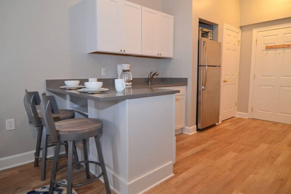 Fully equipped kitchenette features dining space for two