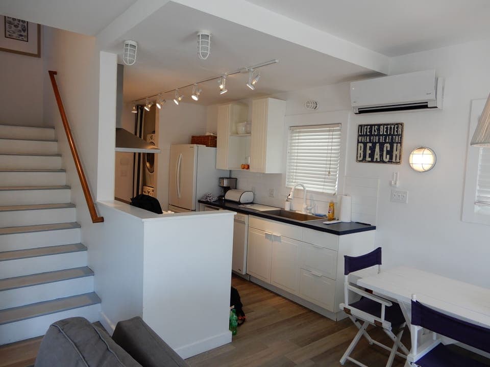 entry to kitchen and stairs to go upstairs