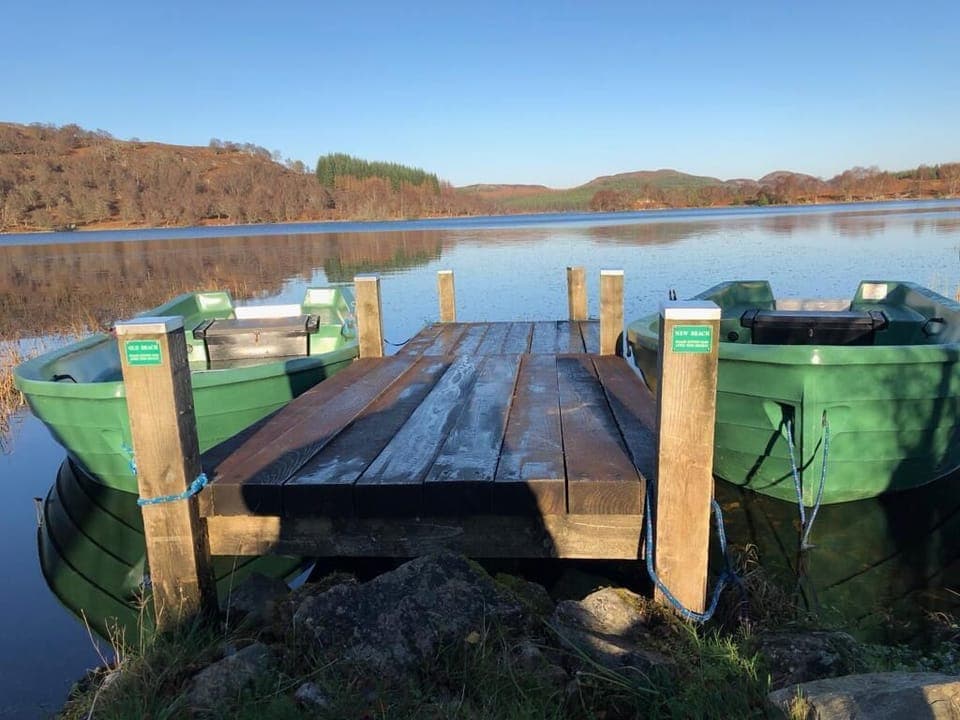Private jetty with rowing boats and canoes. Brown trout fishing available within