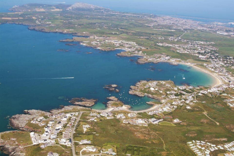 Aerial view of Trearddur Bay and the spectacular rocky coastline