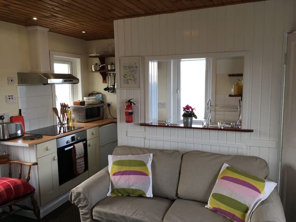 Kitchen area.  Well equipped with induction hob, oven, coffee maker & microwave 