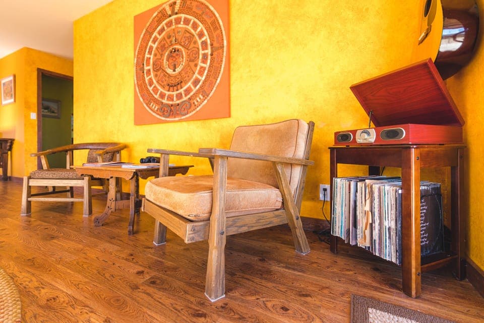 Old school turntable and extensive vinyl collection for you listening pleasure.